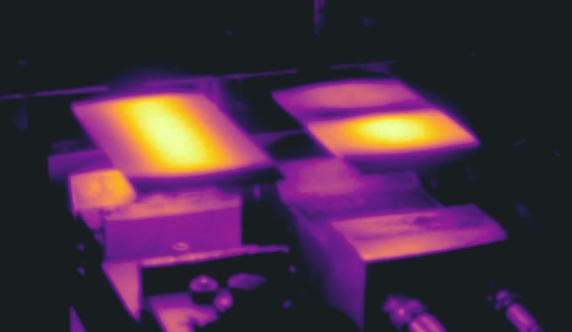 Estimated 2D temperature field across a metal sheet during multi-stage press hardening, shown as a thermal heatmap